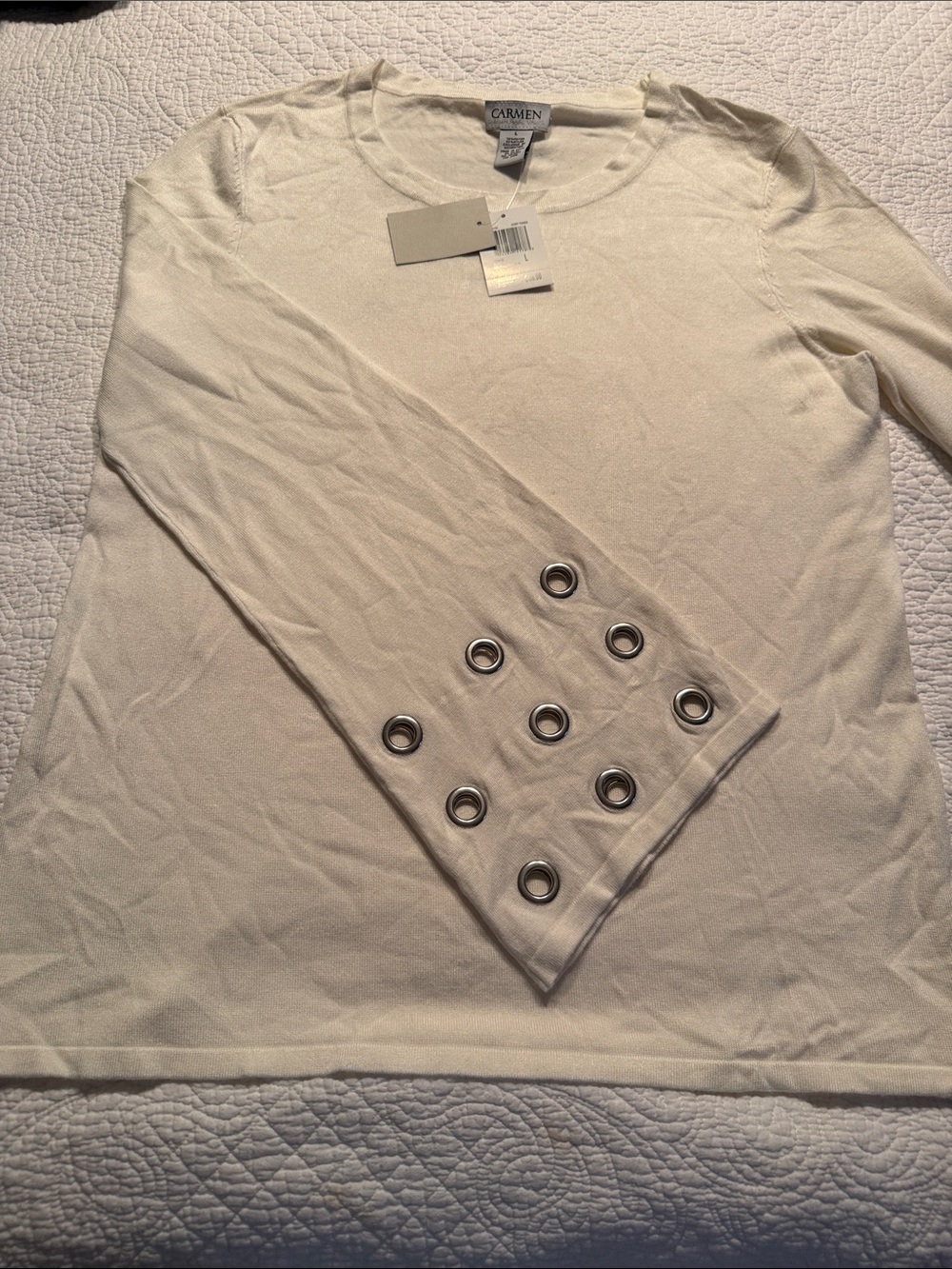 Super cool cream colored sweater with hip extra long grommet detailed sleeves.